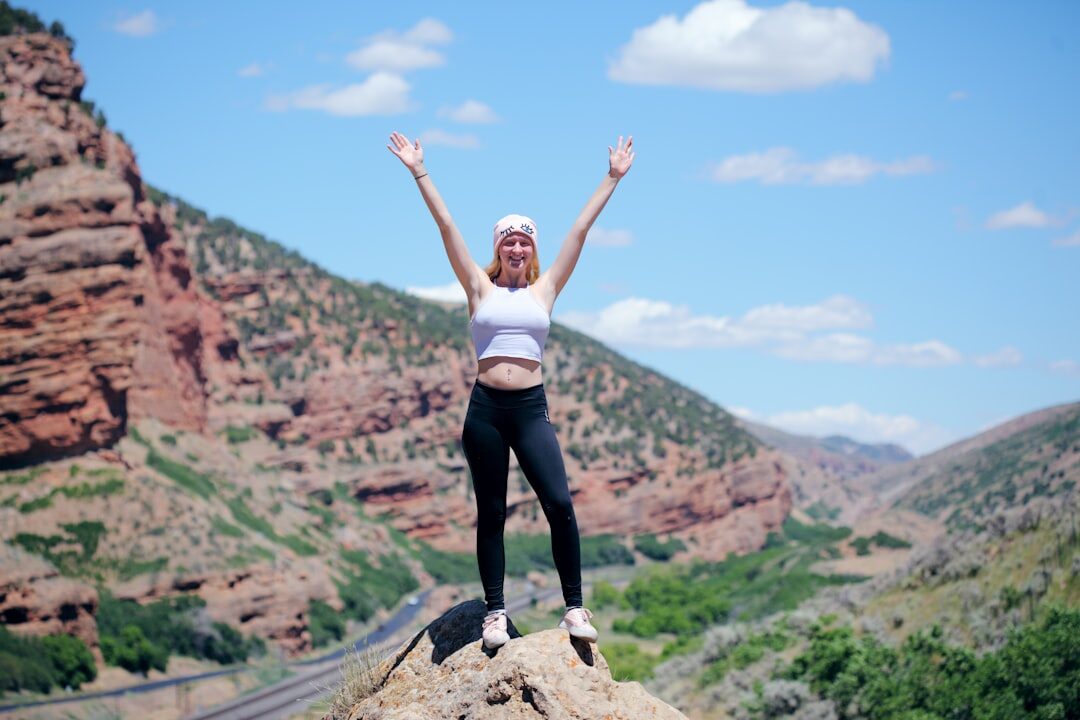person achieving goals outdoors