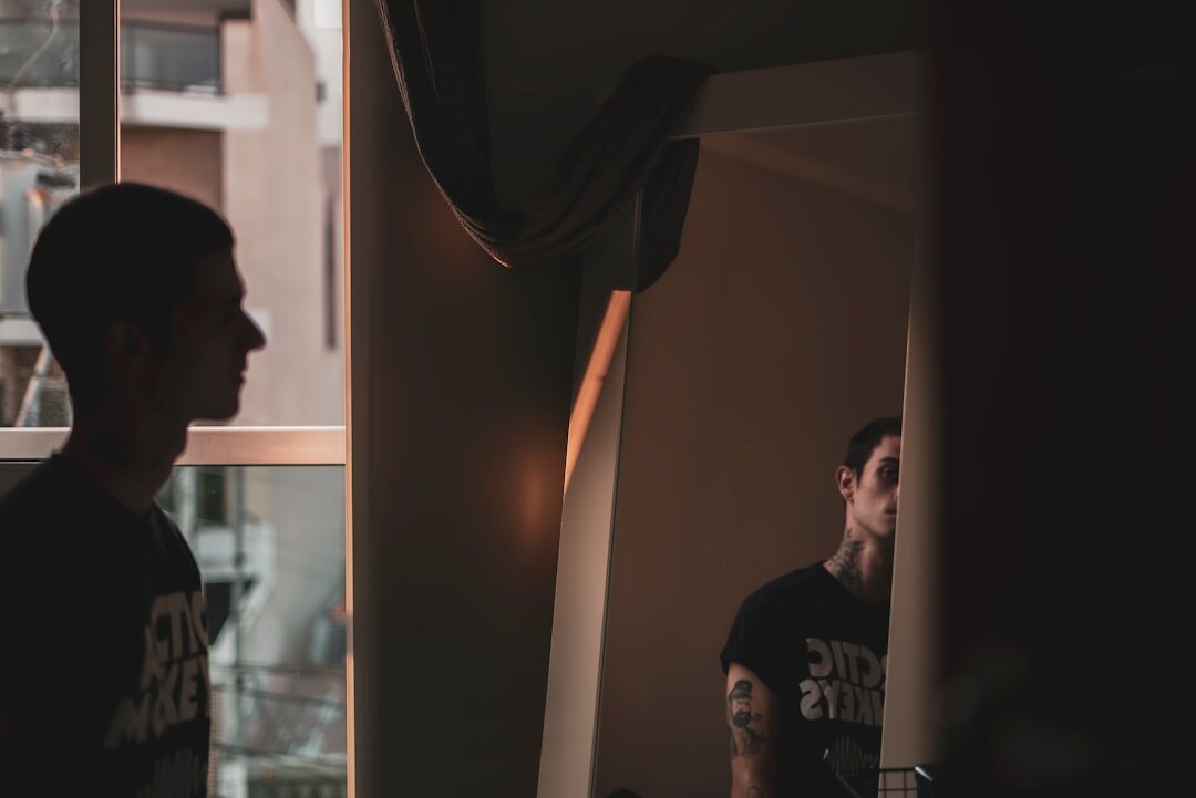 person smiling confidently in mirror