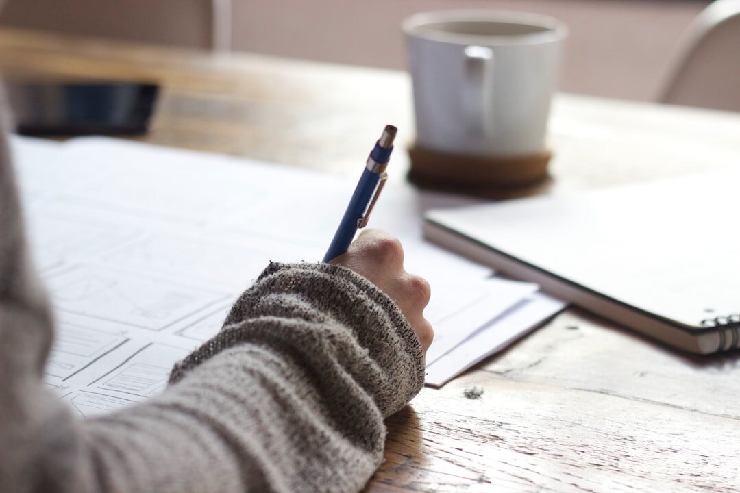 person setting goals on paper
